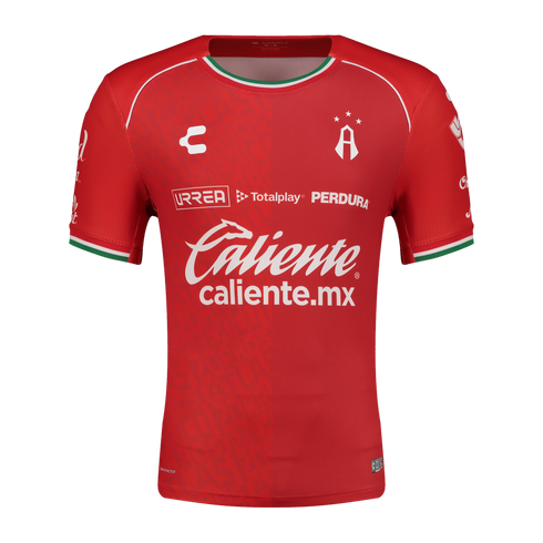 Red Atlas F.C. soccer jersey by Charly featuring white sponsor logos, the club crest, and green and white trim on the collar and sleeve cuffs.