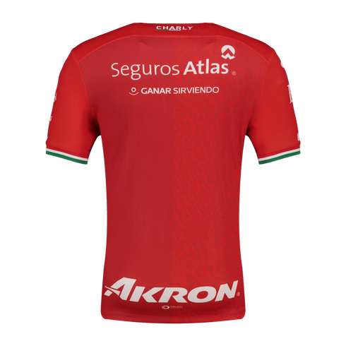 The back of a red Charly soccer jersey with white Seguros Atlas and Akron sponsor logos. The sleeve cuffs feature green, white, and red stripes.