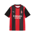 A short-sleeve AC Milan soccer jersey features vertical red and black stripes, the Puma logo, the club crest, and a white "Emirates FLY BETTER" sponsor logo across the center.