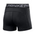 Back view of black Nike Pro compression shorts featuring a grey waistband with "NIKE PRO" text and contoured stitching, isolated on a white background.