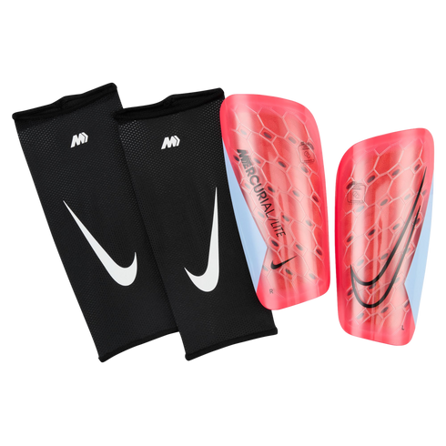 A pair of red Nike Mercurial Lite soccer shin guards next to two black mesh sleeves with white Nike swooshes, all set against a black background.