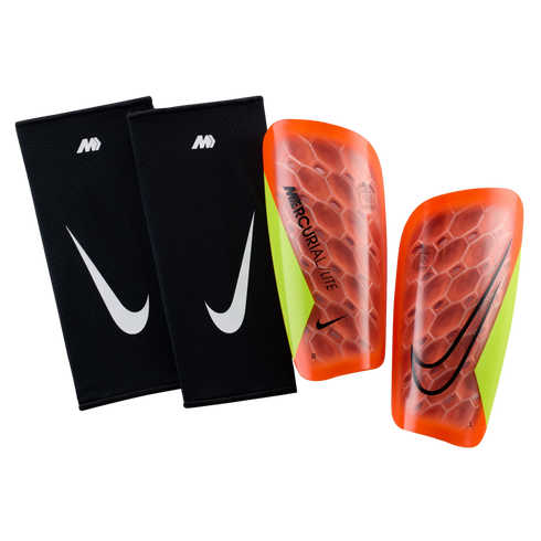 Pair of Nike Mercurial Lite soccer shin guards with two black sleeves and two orange-to-yellow contoured shells on a black background.