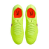 Top-down view of neon yellow Nike Tiempo soccer cleats with bright orange interiors against a black background.