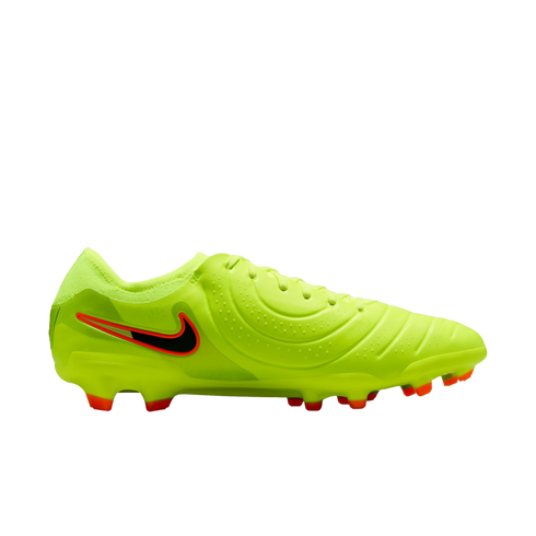 A neon yellow Nike soccer cleat with a black swoosh outlined in orange, featuring orange-tipped studs on a black background.