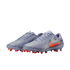 Lavender-grey Nike soccer cleats with a vibrant orange swoosh and orange-tipped studs, shown against a solid black background.