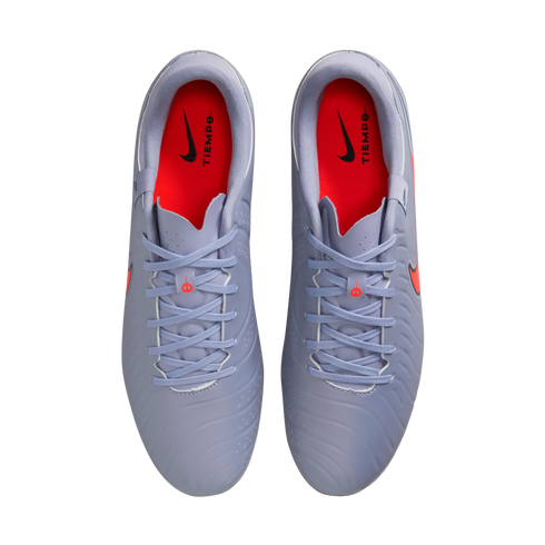Top-down view of light blue Nike Tiempo soccer cleats with bright orange insoles and matching light blue laces against a black background.