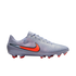 Light purple Nike soccer cleat featuring a large bright orange swoosh and matching red studs against a solid black background.