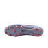 The lavender soleplate of a Nike soccer cleat featuring bright orange studs and a small black swoosh, isolated against a black background.
