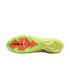 Bottom view of a lime green Nike soccer boot showing the orange forefoot plate with black "AIR ZOOM" text and translucent green studs.