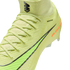 Close-up of a neon yellow Nike soccer cleat with textured Flyknit material, laces, and black accents against a solid black background.