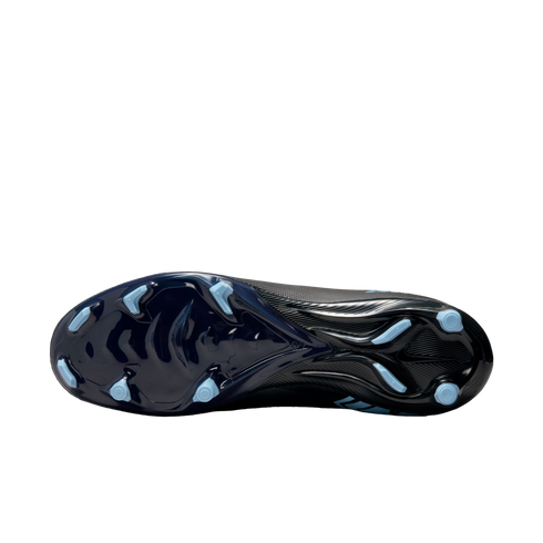 Bottom view of a sleek dark blue and black soccer cleat, highlighting its light blue traction studs against a solid black background.