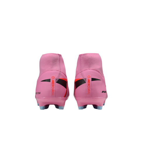 Rear view of a pair of pink Nike Mercurial soccer cleats with black and orange details, set against a black background.