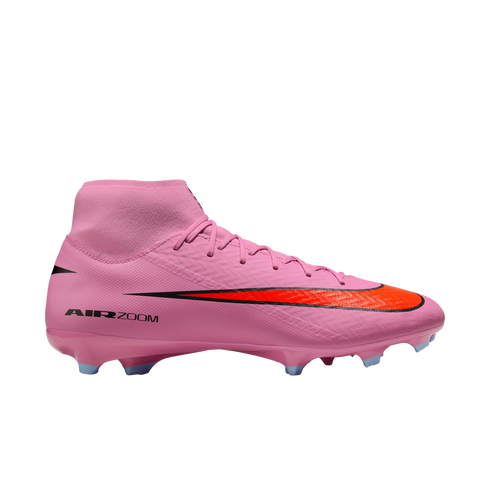 A bright pink Nike soccer cleat with a high-top sock collar, a red-orange swoosh, and "AIR ZOOM" branding on the side, set against a black background.