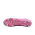 Bottom view of a bright pink soccer cleat featuring light blue studs, set against a solid black background.