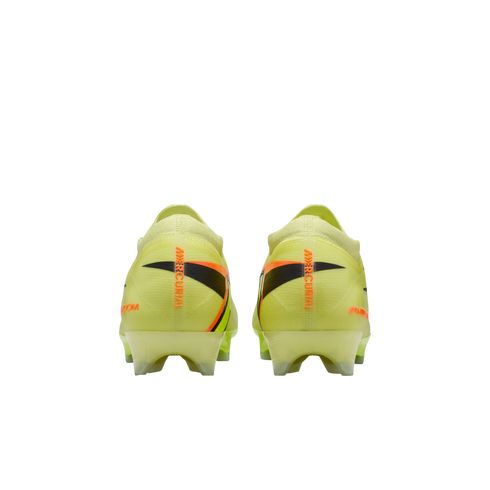 Rear view of neon yellow Nike Mercurial soccer cleats with orange branding and black graphic accents on the heels, set against a black background.