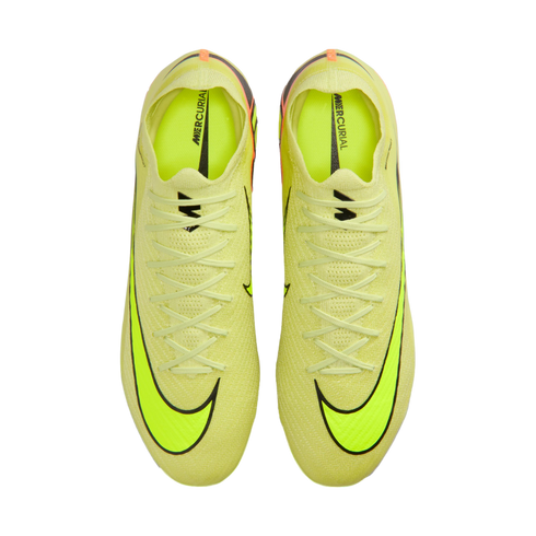 Top-down view of neon yellow Nike Mercurial soccer boots with black swooshes on a black background.