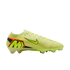 A bright yellow Nike soccer cleat with black and orange accents, featuring a large 'M' logo on the heel, shown against a solid black background.