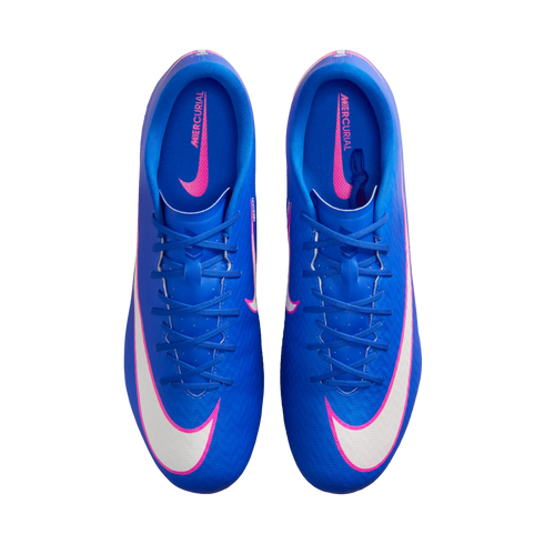 Top-down view of a pair of blue Nike Mercurial soccer cleats with large white and pink swooshes on a black background.
