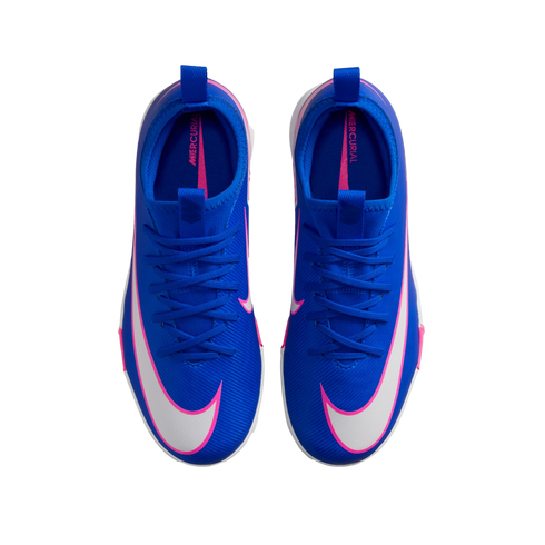 A top-down view of blue Nike Mercurial soccer cleats with white swooshes and pink accents on a solid black background.