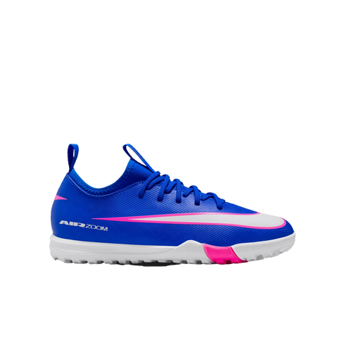 A royal blue Nike Air Zoom turf soccer shoe with a pink-accented white swoosh and white sole, set against a black background.