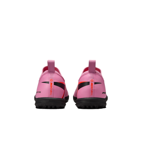 Rear view of two pink Nike Mercurial soccer shoes with black soles and vertical orange branding on the heels against a black background.