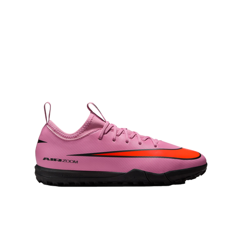 A pink Nike Air Zoom soccer shoe with a vibrant orange swoosh and black sole, shown in profile against a black background.