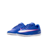 A pair of blue Nike Mercurial indoor soccer shoes with white and pink swooshes, shown against a solid black background.