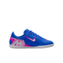 Blue Nike indoor soccer shoe with pink and white accents, featuring a stylized "M" on the heel and a pink swoosh on the side.