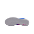 Bottom view of a white Nike shoe sole featuring an intricate tread pattern and a small pink swoosh on the heel, set against a black background.