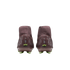 Rear view of two maroon Nike high-top soccer cleats with lime green studs and silver dot patterns, set against a black background.