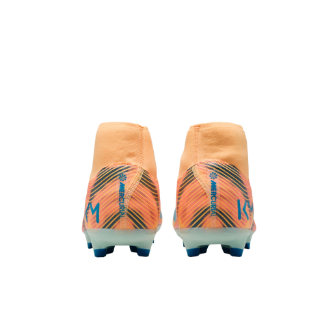 Back view of two orange Nike Mercurial KM soccer cleats with blue and black diagonal patterns and blue studs against a black background.