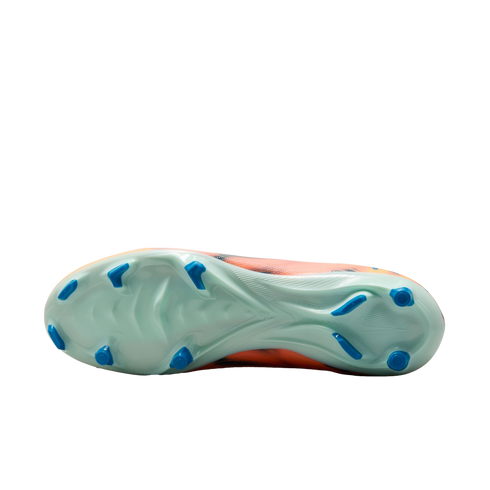 The bottom of a light green soccer cleat with blue studs and an orange upper, shown against a solid black background.