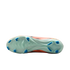 The bottom of a light green soccer cleat with blue studs and an orange upper, shown against a solid black background.