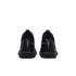 Rear view of two black Nike Mercurial turf soccer shoes with light blue accents against a black background.