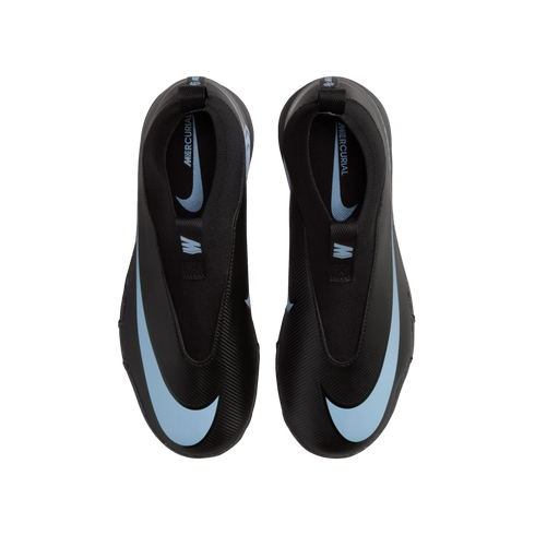 Top-down view of black Nike Mercurial laceless soccer cleats with light blue swooshes, displayed on a black background.