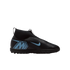 Side profile of a black laceless Nike Mercurial soccer shoe with light blue "M" and swoosh logos, featuring a high-top sock-like ankle collar.