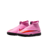 A pair of pink laceless Nike Air Zoom soccer shoes with a red swoosh and black turf soles, set against a black background.