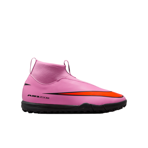 Side view of a pink Nike Air Zoom turf soccer shoe with a sock-like collar and a large orange Nike swoosh, set against a black background.