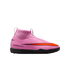 Side view of a pink Nike Air Zoom turf soccer shoe with a sock-like collar and a large orange Nike swoosh, set against a black background.