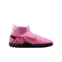 A pink Nike Mercurial high-top soccer cleat with an orange swoosh and stylized 'M' logo, shown from a side profile against a solid black background.