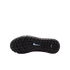 The black rubber outsole of a Nike turf shoe with a white swoosh logo and rectangular traction studs, shown against a black background.
