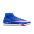 Blue Nike Air Zoom Mercurial soccer shoe with pink and white accents and a high-top collar, shown from the side against a black background.