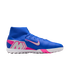 Side profile of a blue Nike Mercurial turf soccer shoe with pink accents, a silver "M" logo, high-top collar, and white lugged outsole.