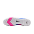 Bottom view of a white Nike soccer shoe sole with pink chevron patterns, small square treads, and a black swoosh logo.