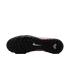 The black, multi-studded sole of a pink Nike soccer shoe features a light blue swoosh in the center and a white chevron logo on the heel.