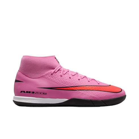 Vibrant pink Nike soccer shoe featuring a high-top collar, a large black and red swoosh, and "AIR ZOOM" branding on the side against a black background.