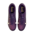 Top-down view of purple Nike soccer cleats with a textured gradient upper, white swooshes, and gold branding on the insoles against a white background.