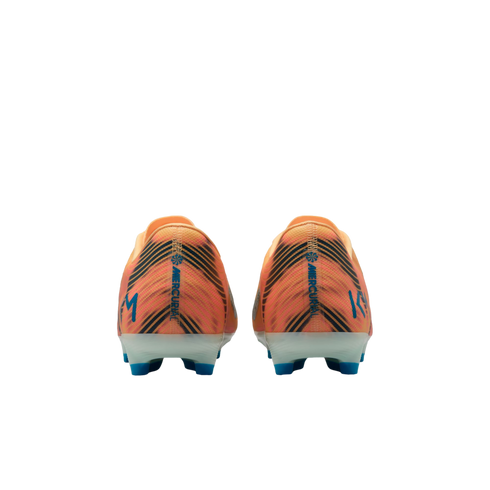 Rear view of orange and black Nike Mercurial soccer cleats with blue "KM" logos and studs.