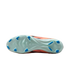 Sole of a light green soccer cleat with bright blue studs and an orange and black upper.
