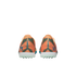 Rear view of orange and teal striped Nike Mercurial turf soccer shoes with "KM" initials on the heels against a black background.